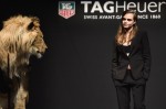 Model Cara Delevingne walks the runway with a lion as she joins TAG Heuer as Brand Ambassador to launch the new 2015 campaign at Palais des Beaux-Arts on January 23, 2015 in Paris, France.