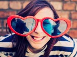 Teenage girl wearing heart sunglasses